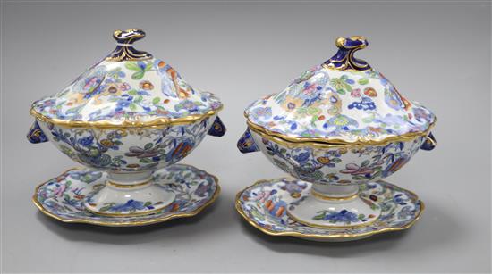 A pair of Victorian ironstone sauce tureens and stands H.18cm